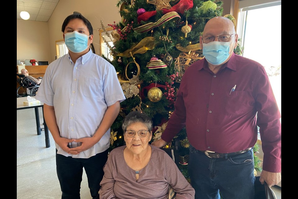 Connor StandingReady, with parents Almer and Darlene at the Moose Mountain Lodge. 
