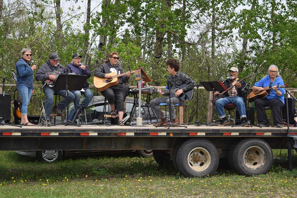 Just a short walk from where the draft horses spent a good part of the weekend working during PALS Draft Horse Field Days in Rama, music for Cowboy Church was provided by, from left: Nancy Genoway from Rama (vocals & spoons), Shelden Landstad from Rama (vocals, guitar & mandolin), Judy Johnson from Preeceville (vocals), Marilyn Fredsberg from Wynyard  (vocals & 12 string guitar) Jordan Halifax from Calgary (vocals & guitar), Gene McKenzie from Wynyard (vocals & bass guitar) and Pauline Stefankew from Fishing Lake (vocals & guitar).