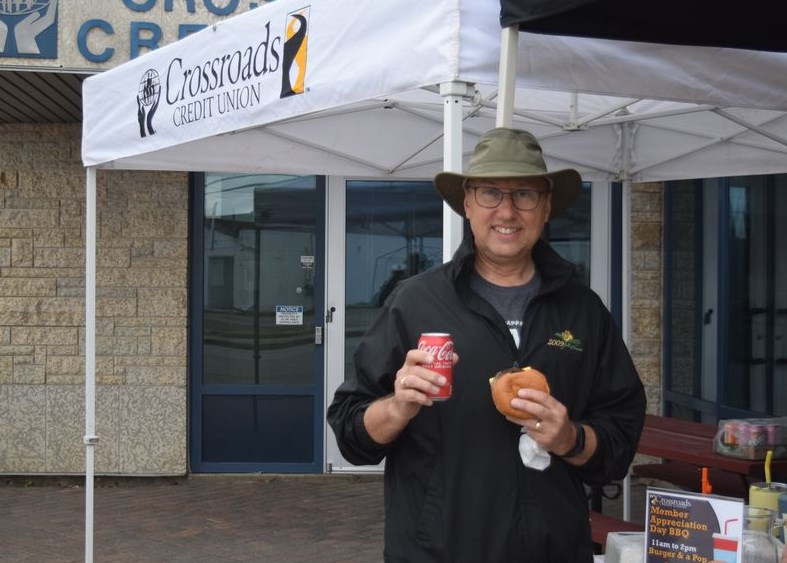 Craig Popoff was one of many local residents who stopped in for a tasty burger and pop while supporting Canora’s Filling The Gap Food Bank, at the barbecue fundraiser put on by Crossroads Credit Union in Canora on June 21.