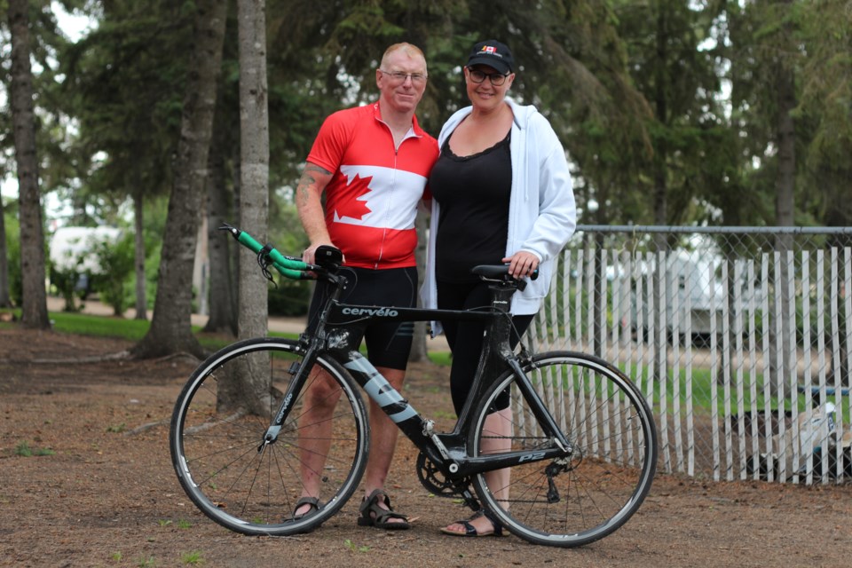 Sgt Rob Nederlof and wife Marina, pictured here at the City of Yorkton campgrounds with his Cervelo road bicycle.