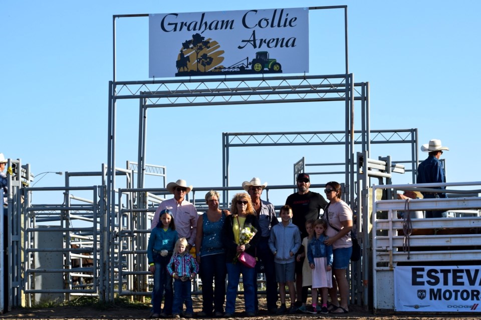 Graham Collie and his family stand under the board with the new arena name. 