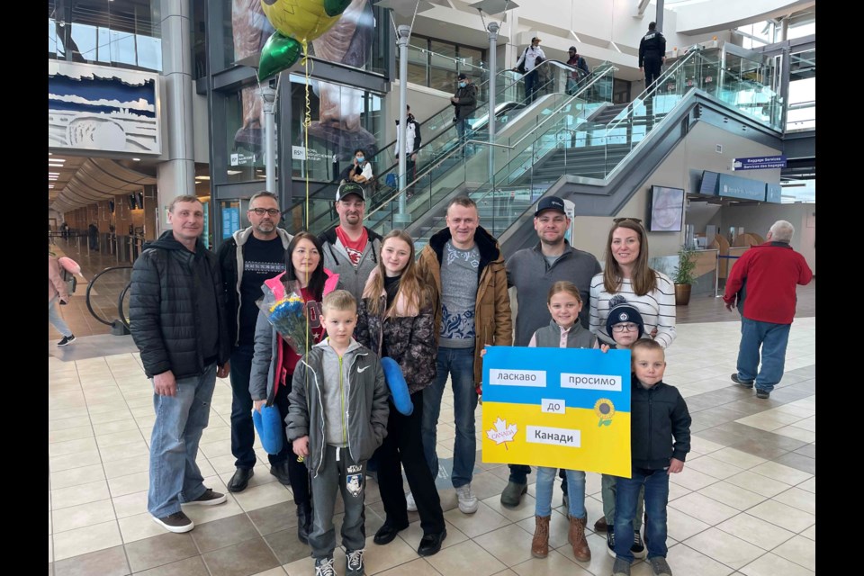 Meeting at the Regina International Airport were, from left, Alex Sych, Volodymyr Bendasyuk, Brian Petersen, Volodymyr Nedozhdii, Josh Biggs and Kristin Biggs. Front row, Yevheniia Nedozhdii, Rostyslav Nedozhdii, Karyna Nedozhdii, Anna Biggs, Jake Biggs and Nash Biggs. 