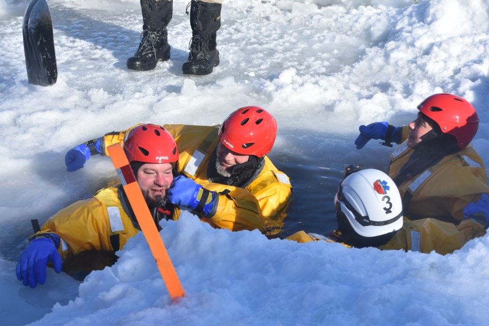 In full flotation gear, all the firefighters had a chance to dip into the water, where they would have to first let out the air from their suits as they entered the water, known as “burping” the suit, assisted by instructor Chris Beblow. This “burping” would help the firefighters better control themselves in the water, otherwise they risk their legs floating up.