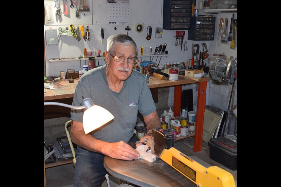 After first being introduced to woodworking back in elementary school, Bill Foreman of Canora says he has really enjoyed getting back into it now that he is retired. Here he is utilizing his trusty scroll saw to cut out the pattern for spider monkeys.