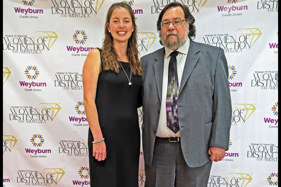 Review editor Greg Nikkel posed with Arliss Sidloski as she was to receive the award as the Young Woman of Distinction for 2024, at the Women of Distinction gala on Friday night.