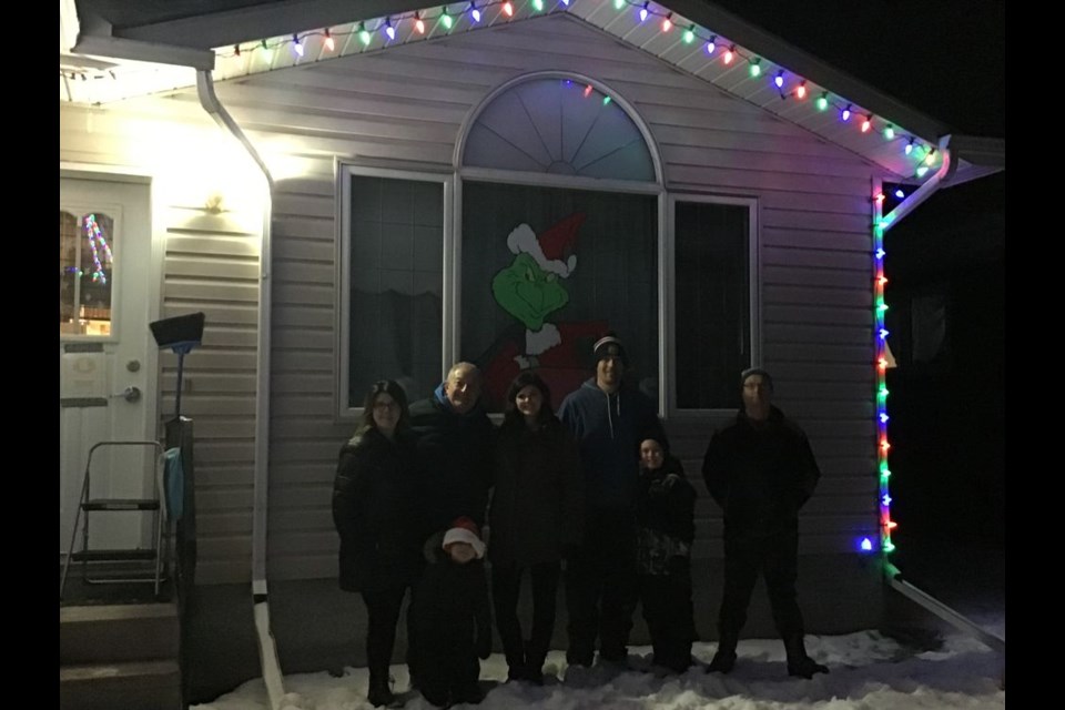 The Canora Group Home received a special gift on the evening of December 14, new Christmas lights. The lights were donated by: Mayor Mike Kwas, Jessica Kwas, MLA Terry Dennis, Lori Dennis, Deryl Ortynsky, Joan Kowalyshyn, Kelly McTavish and Jodie Kowalyshyn. In the photo, from left, were: (back row) Joan Kowalyshyn, MLA Terry Dennis, Jessica Kwas and Mayor Mike Kwas, and Lionel, Group Home resident. Also in the photo were Van Kwas and his younger brother Monty, sons of Jessica and Mike. / Canora Group Home
