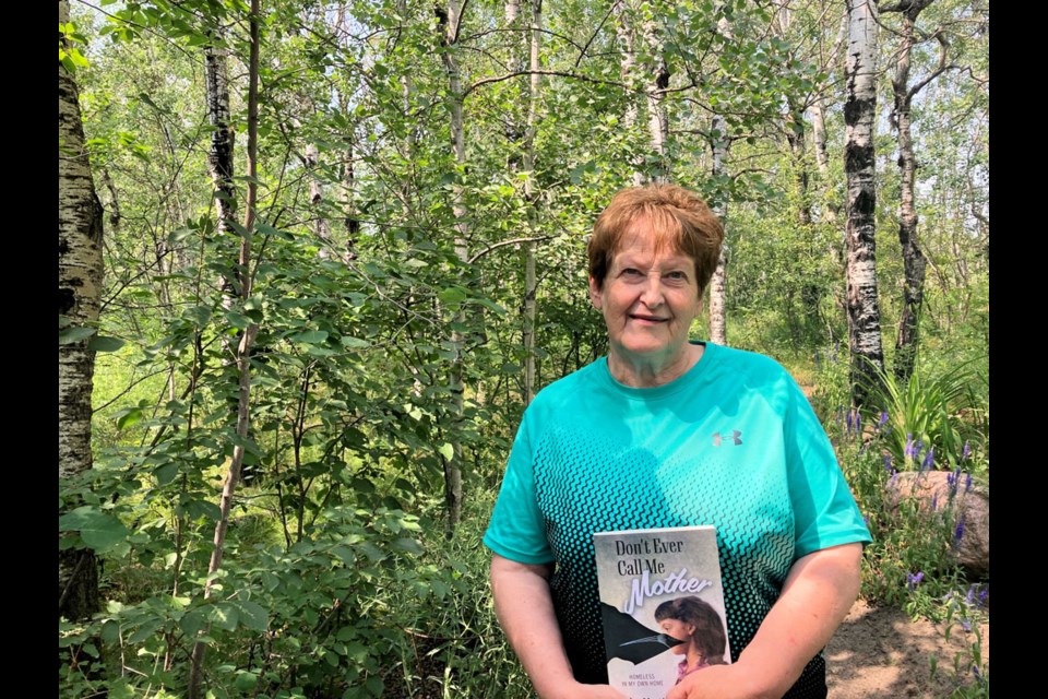 Helen Martin with her book, Don’t Ever Call Me Mother; Homeless in My Own Home, in the peace and quiet of nature.