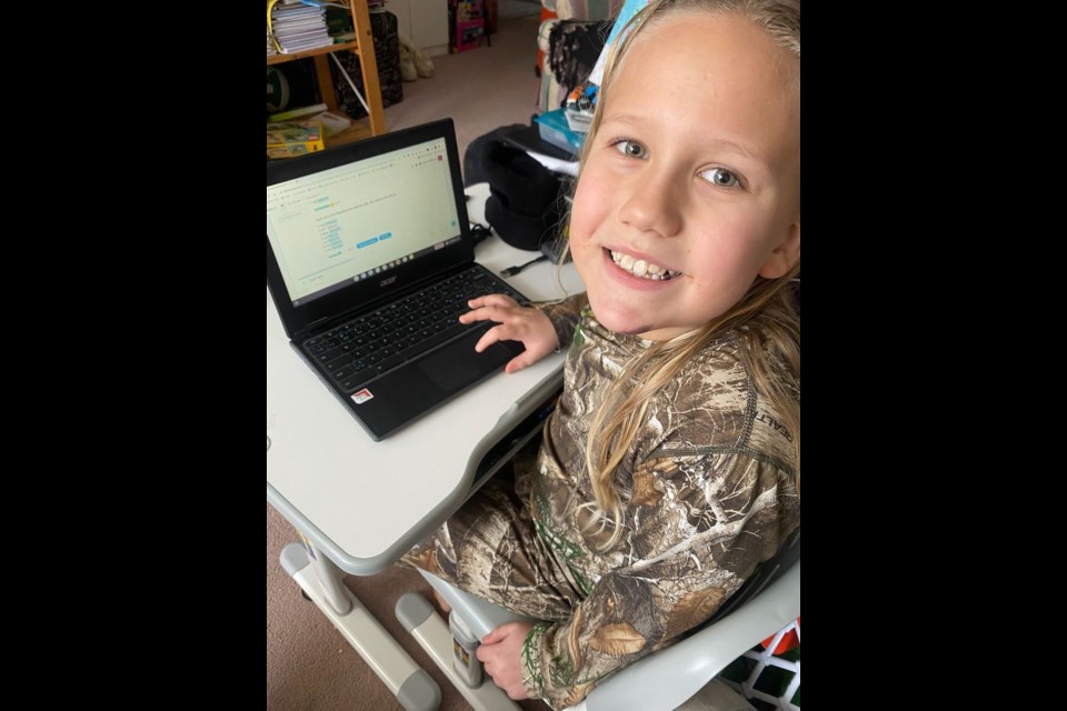 For nine-year-old Kayman Nikiforoff of Kamsack, online learning requires doing his school work on a laptop computer and attending regular Zoom meetings with his teachers, coaches, and fellow online classmates.