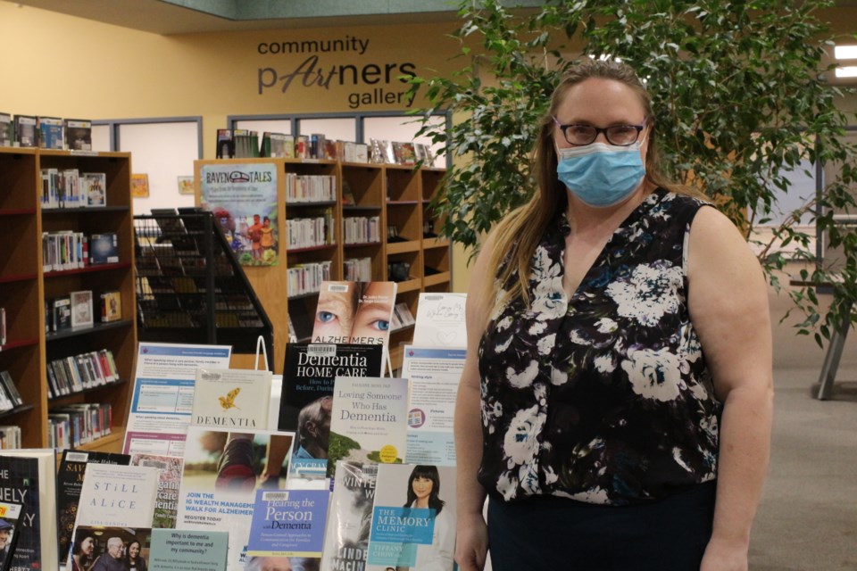 Jackie Hofstrand of the Alzheimer’s Society stands next to a display of various literature on the subject of dementia at the Yorkton Public Library.