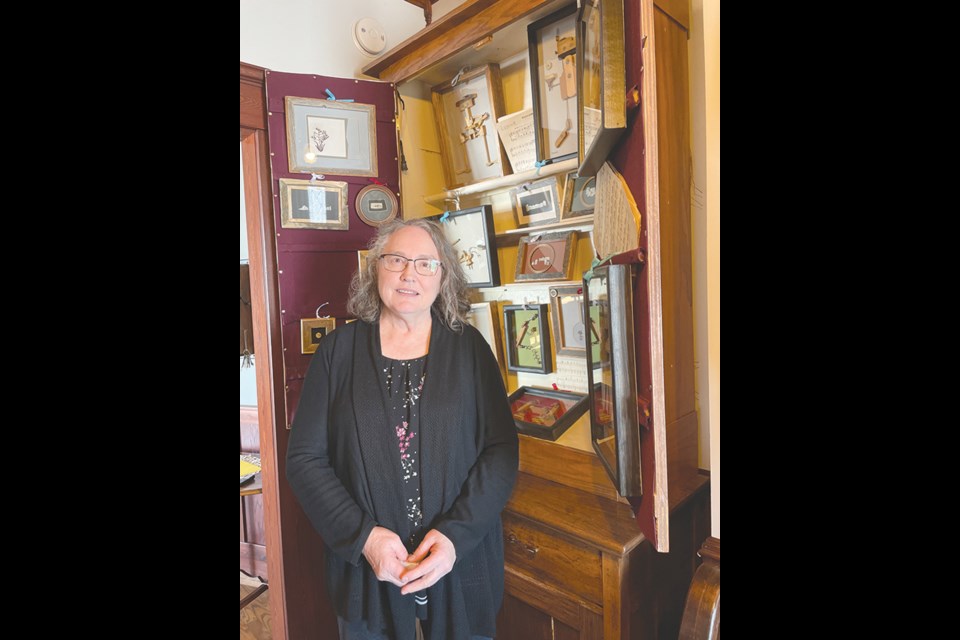 Beautiful cabinets full of art greet visitors to her home. Pieces reclaimed from old pianos become works of art in her hands.

