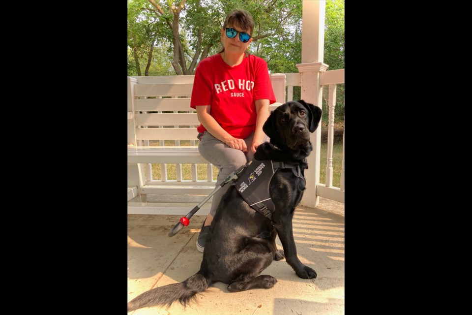 Jodi Laycock of Luseland and her dog Shadow, now graduates of the CNIB Guide Dog program.