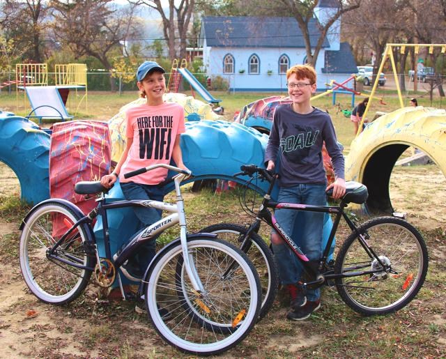 Kye Chase and his friend Ashton Hansen hang out together. Kye is displaying a rescue bike that was given to him by Wes Bloom.