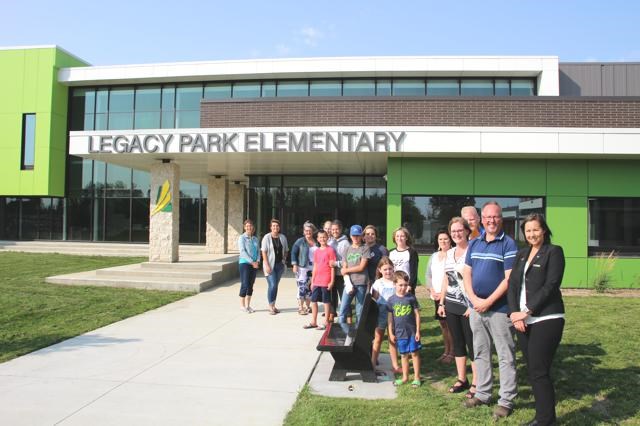 A few members of the former School Community Councils of Queen Elizabeth, Souris and Haig School attended a special event to unveil the new memorial benches at Legacy Park Elementary School.