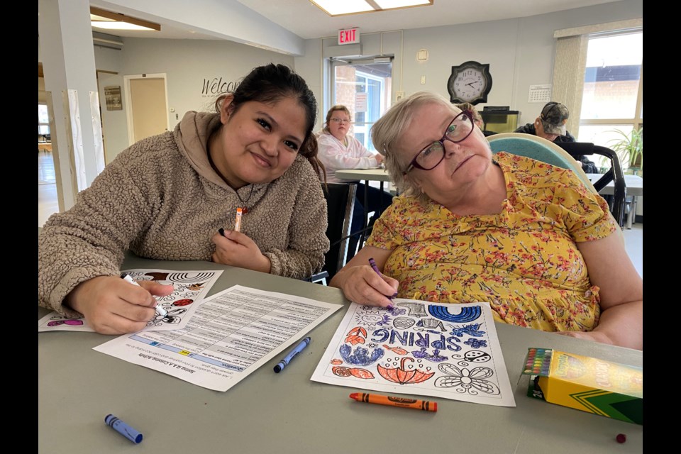 Aubrey and Heather bond over colouring.