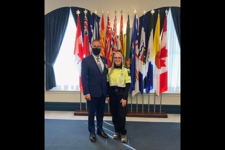 Presenting the medal to Mydonick-Chernoff was Lieutenant Governor of Saskatchewan, Russell Mirasty, (left).