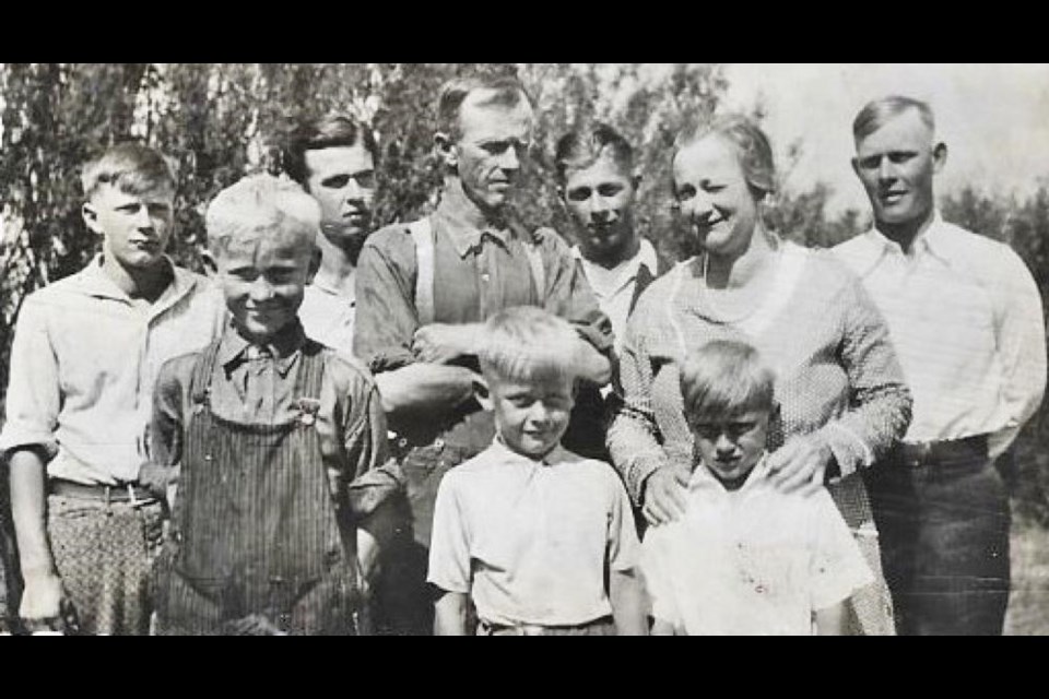 This is the Mitchell family, shown about a decade before the start of the Second World War. In the back are Jim, Rex, Orm and Bruce; in the middle are Don, and T.H. and Eva Mitchell; and in front are Grant and Clary.