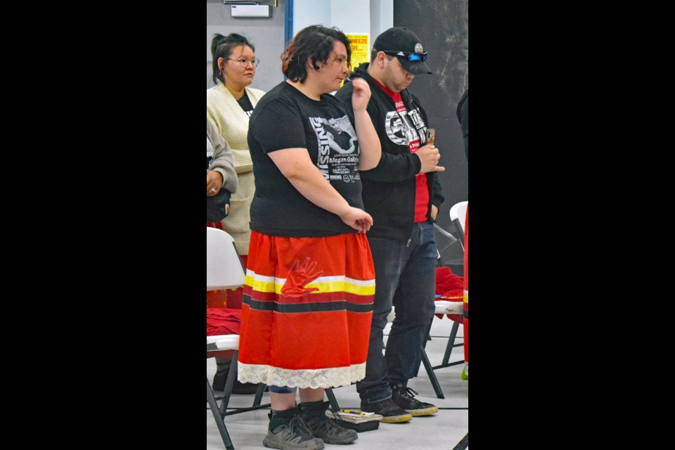 Derek Bishop, right, and his wife Lindsey listen to some messages in a brief welcome event April 8 at the Indian and Métis Friendship Centre in Saskatoon.