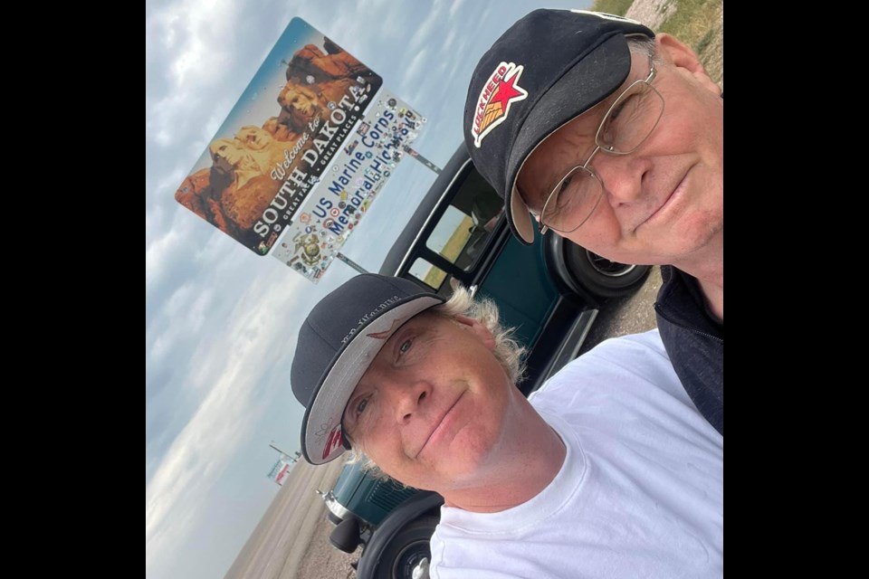 Unity's Kelly McLellan poses with his travel adventure partner, Uncle Phil, who helped share the drive back from Iowa with McLellan's newest purchase for his car collection.