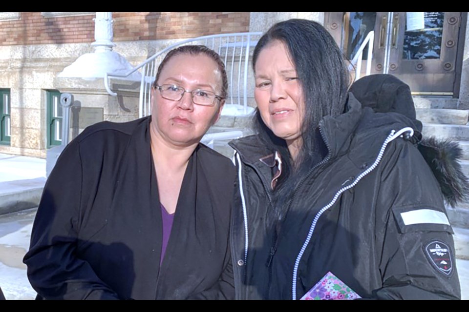 Nerissa (left) and Odelia Quewezance talk with reporters before a day in court Nov. 30, 2022, to decide if a publication ban will be placed during their subsequent bail hearing.