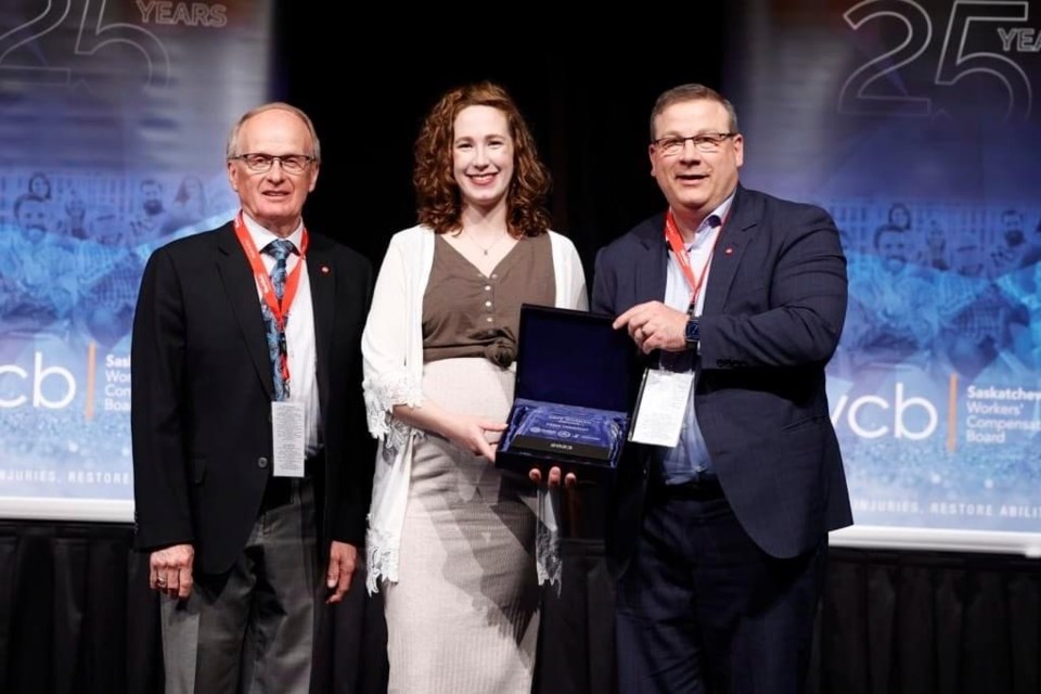 WorkSafe Saskatchewan 2023 Safe Worker Award winner Paige Freistadt with WCB chair Gord Dobrowolsky (left) and WCB CEO Phillip Germain (right).