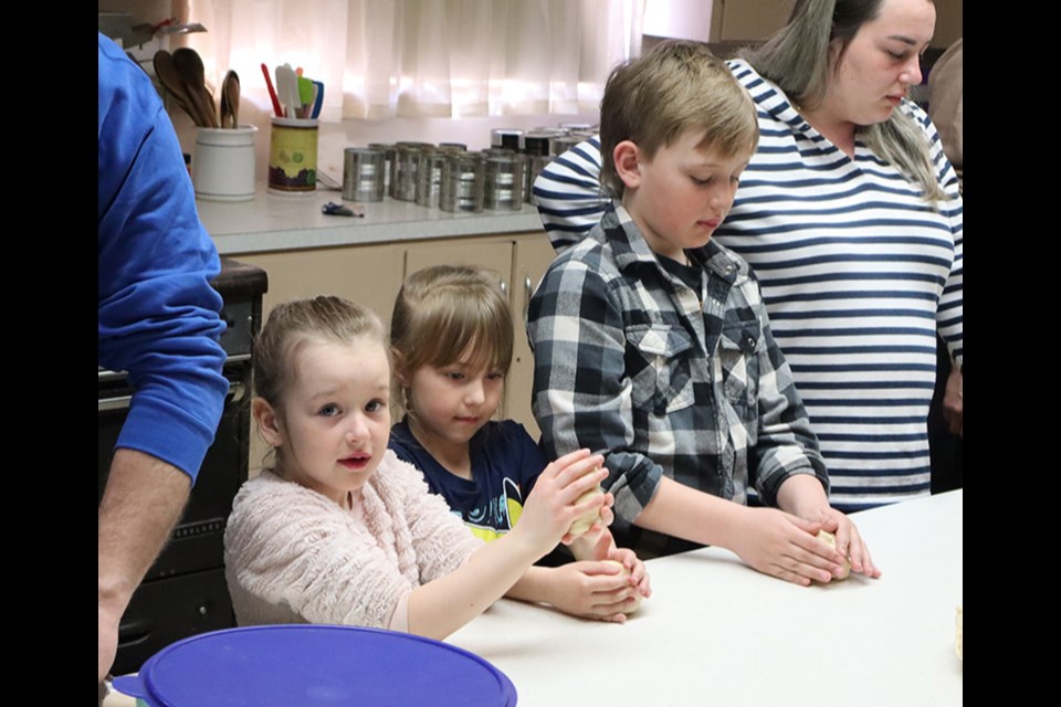 These Sunday School students, ranging in age from two to seven, appeared to enjoy working on the paska at the paska workshop on April 5 at Rainbow Hall. The majority of the participants and their families recently came to Canora from war-torn Ukraine.