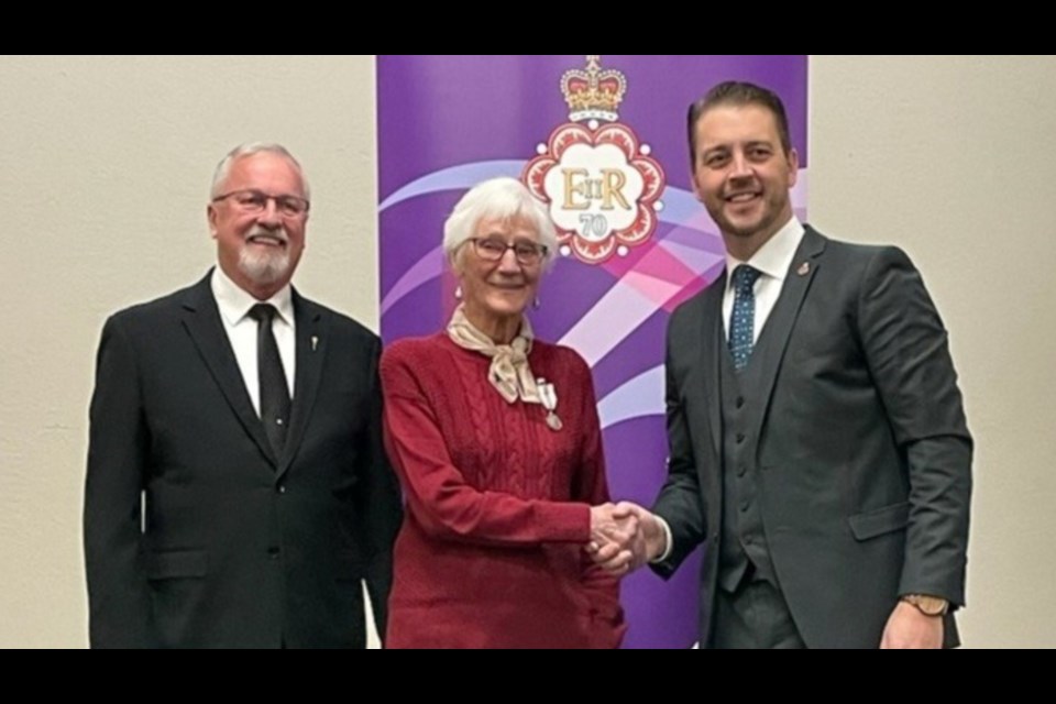 Peggy Looby of Bjorkdale was recognized for her outstanding volunteerism with a Queen Elizabeth II Platinum Jubilee Medal. From left are MLA Hugh Nerlien, Peggy Looby and Provincial Secretary and Legislative Secretary to the Premier Tim McLeod.
