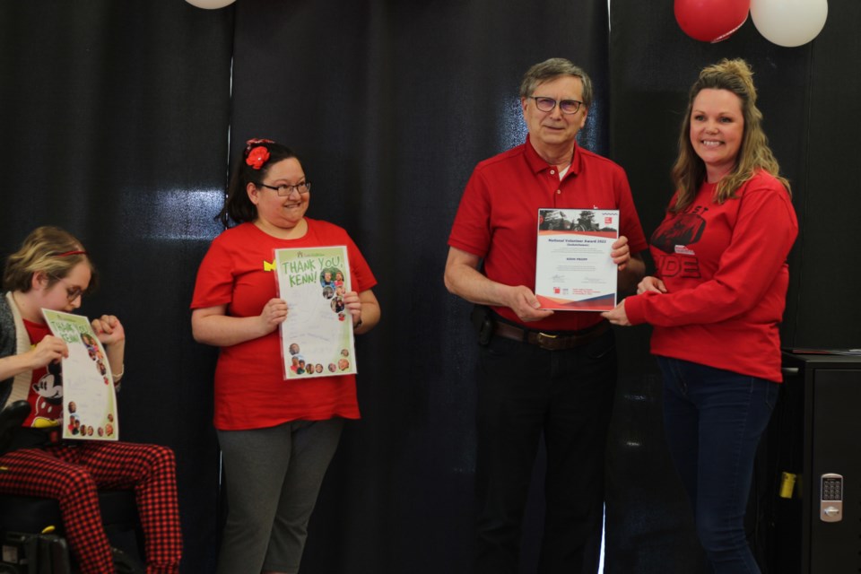 Ken Propp accepting his award from Sask Abilities Community Relations Co-ordinator, Deana Jesmer.