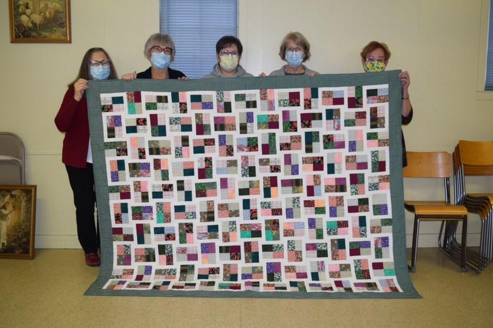 A Common Thread, a Canora needlework group, strives to make at least one quilt per year to donate to worthwhile projects. This is one of the recently completed quilts which have been donated to the Regina Cancer Lodge to help with the lodge’s fundraising. From left, were: Doris Kopelchuk, Oney Pollock, Jopie Lavrysen, Karen Kraynick and Julia Westerman. Group members unavailable for the photo were: Janet Hill, Renee Langan, Gladys Tomski, Julie Kraynick, Laverne Rawlick, Carolle Pasiechnik, Donna Spelchen, Kathleen Harris, Roanna Ross, Dawn Leegwater and Brenda Penny. / Rocky Neufeld