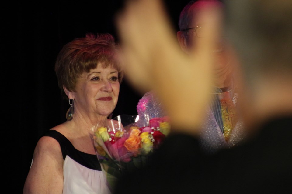 Randy Goulden, accepting a bouquet of flowers in thanks from YFF Co-chair, Keith Hayward.