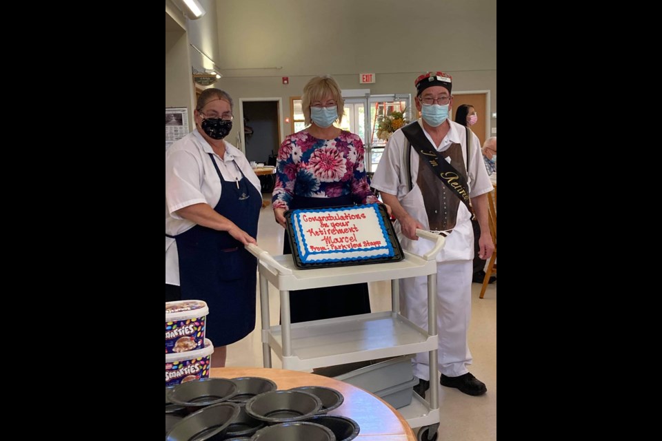 New Parkview Place cook Sandra Porsnuk, manager Paula Sittler and newly retired head cook Marcel Boucher pose with the celebration cake at this Sept. 29 retirement event.