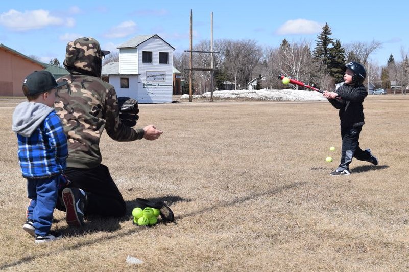 Six-year-old Lowell Rice smoked a line drive on a pitch from his dad Parker, while his brother Lachlan, 3, was ready to show off his fielding skills. Along with many others in and around Canora on May 1, the Rice boys were enjoying the welcome and long overdue arrival of spring-like weather.