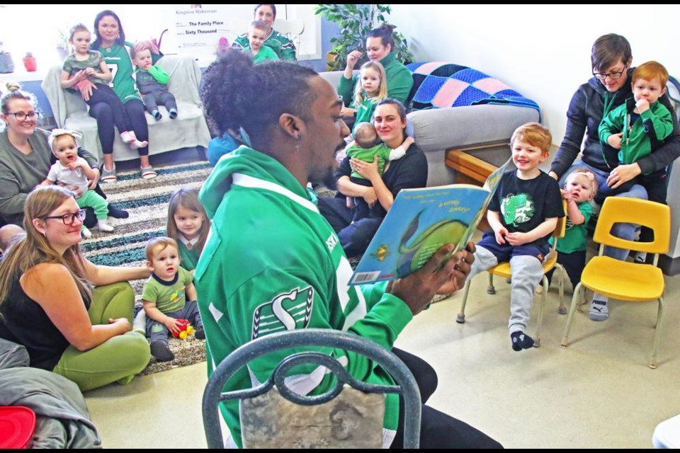 Frankie Hickson, a running back for the Saskatchewan Roughriders, read "The Wonky Donkey" for young children and their parents on Monday morning at the Family Place.