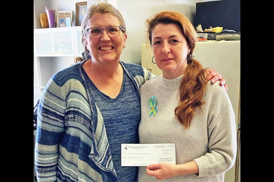 Sandra Mryglod presented Julia Peregon with a cheque for $9,455, including a matching amount from Mryglod Steel, from the brunch held on March 26 at the Legion Hall