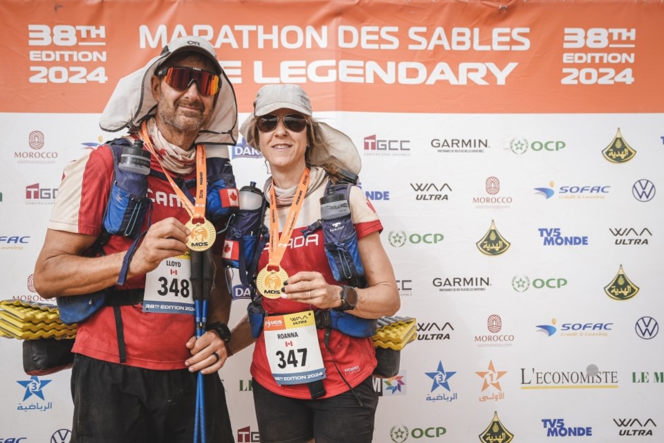 Lloyd and Roanna Sehn show off their medals at the 2024 Marathon Des Sables.
