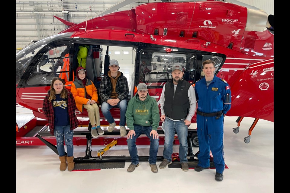 Sheldon Ducherer, Unity, stands with his children at a STARS VIP event where he had the opportunity to meet, and thank, those responsible for his life-saving rescue Jan. 16, 2022.