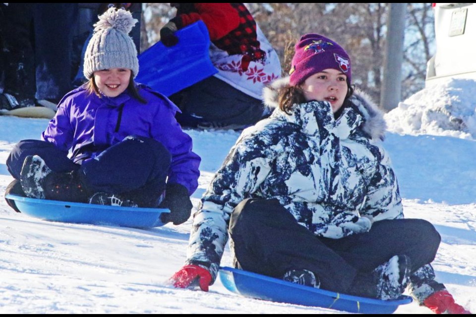 Two girls began their ride down Weyburn's sledding hill on Sunday afternoon, with a balmy -9 degrees on the last day of Christmas-New Year's vacation