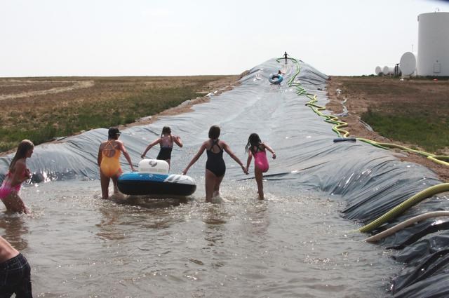 A large grain bag was used to create a fun slip n' slide adventure on a Meyronne farm.