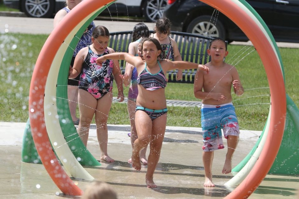 Kylee Parmley, centre, dances through the water-spraying rings at Chase Kraynick Memorial Splash Park. To her left is Sophie Monich and her right is Parker Bryant. They were there as part of a June 27 excursion from the Grade 1 and 2 classes at Canora Junior Elementary School to celebrate the end of the school year.