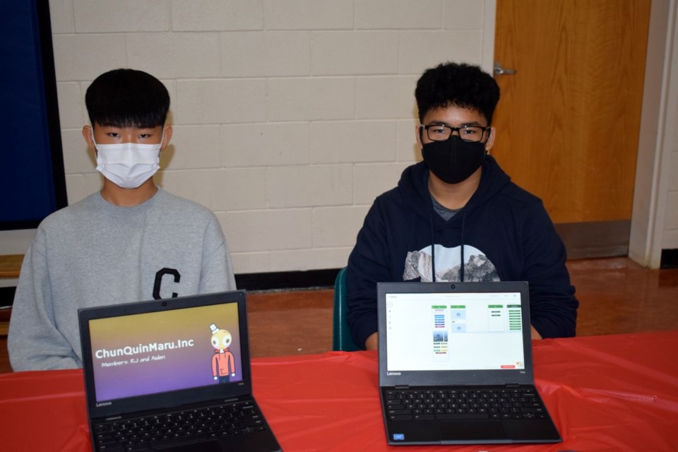 Aiden Chun, left, and RJ Quin had their Estevan information app.