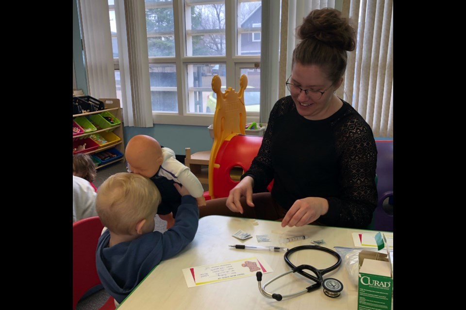 Branson gets his doll checked over by public health nurse Heather Batty, during a recent Teddy Bear Clinic hosted in Assiniboia.