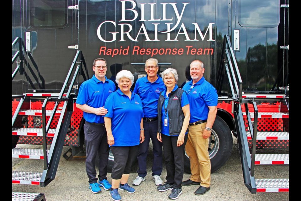 Weyburn pastor Tim MacKinnon is with the Billy Graham Rapid Response Team at their mobile trailer in Dauphin, Man., ready to counsel or chat with those affected by the recent bus crash near Dauphin. With Tim from left to right are Glenda Schwarz of Morden, Man.; John Fleck of Calgary; Wanda Burchert, Canyon, B.C.; and Merle Doherty, the Rapid Response Team manager from Calgary.