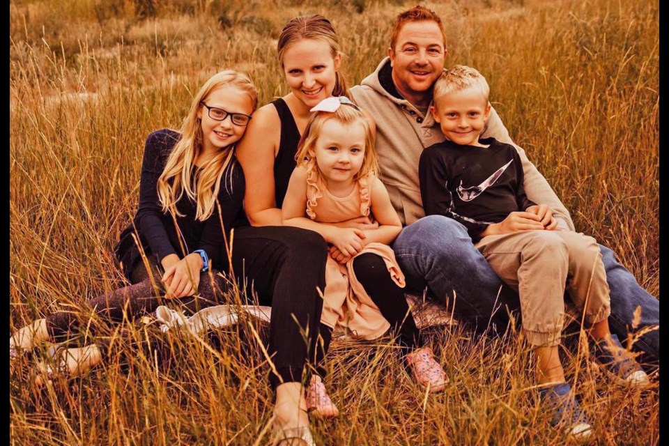 Tyler Hillstead relaxed with his family for a portrait, taken by Jessica Hunter. He is with wife Melissa, and children Lexi, Kabri and Ben.