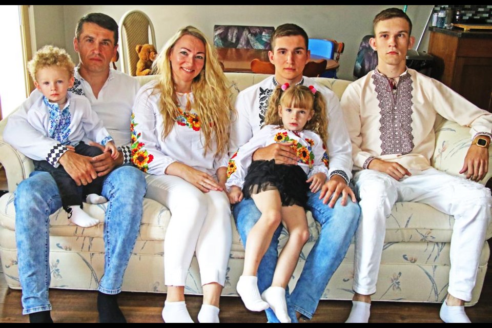 The Dmytryshyn family are now settled into their home in Weyburn after fleeing their home and their lives in Ukraine. From left are father Vasyl holding youngest son Vladislav; mom Tetiana; son Vitalii with young sister Zlata, and oldest son Oleh.