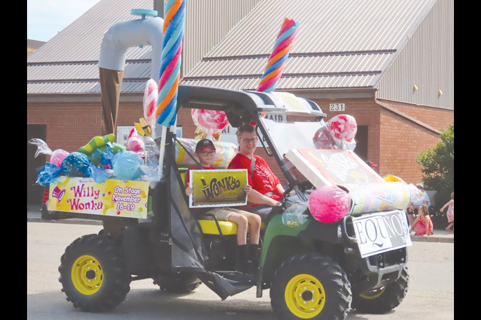 Audiences got a sneak peak of the fun and colorful world they can expect in “Willy Wonka” with a float created by the group for the Canada Day parade. Sheri Lovrod (director) and Jonah Turton (cast) invited people into the world of pure imagination.

