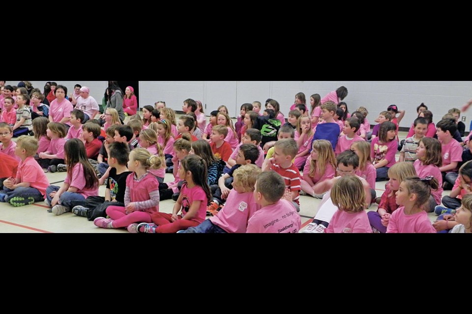 A sea of pink during a school assembly on Pink Shirt Day, reminding students to be kind to everyone.