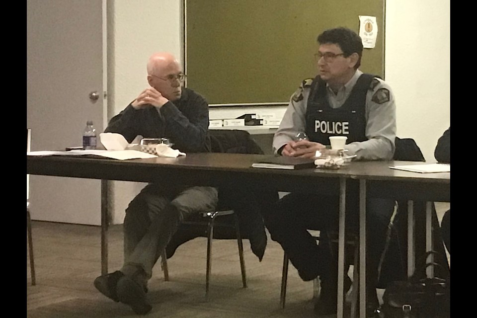 Doug Fehr of Citizens on Patrol and S/Sgt. Jason Teniuk of Battlefords RCMP present to the Battlefords Chamber on April 19.