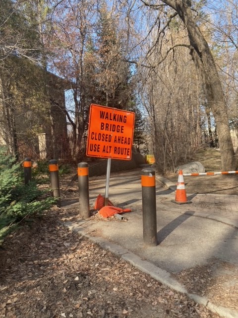 The path leading to Gabriel Dumont walking bridge, off of Saskatchewan Crescent, was blocked off due to fire damage sustained April 11.