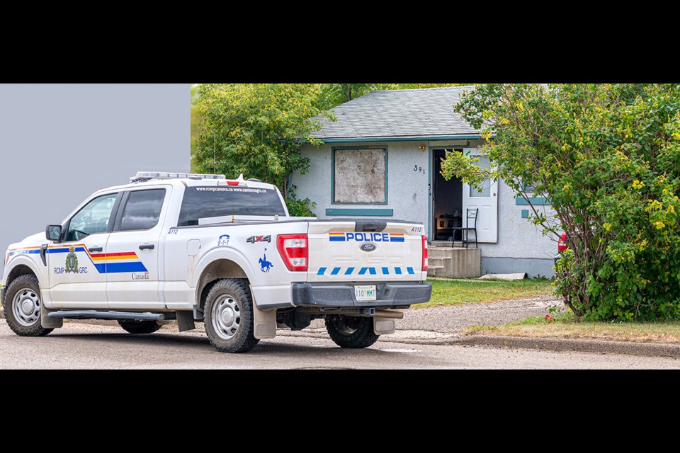 A police vehicle sits in front of a house on 33rd street in Battleford.