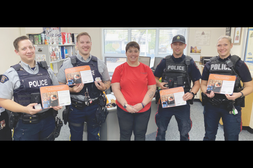 Members of the Weyburn RCMP detachment and the Weyburn Police Service were recognized for apprehending impaired drivers. From left are Const. Vincent Clifford and Const. Matt Bujold, Weyburn RCMP Detachment; Connie Hagel, community leader for Mothers Against Drunk Driving (MADD) Estevan; Cpl. Riley Ross and Const. Maralee McSherry, Weyburn Police Service. Missing was Sgt. Cathy Walter, RCMP Combined traffic services; and Const. Jake Sonnenberg, WPS. 