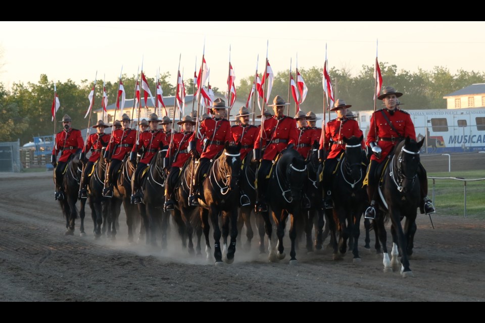 The RCMP Musical Ride heads from the barns to the grandstand,